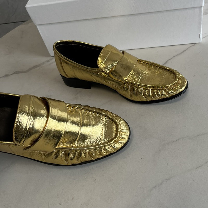 Eel skin loafers for women by Rossie Viren, featuring sleek design and textured eel skin material.