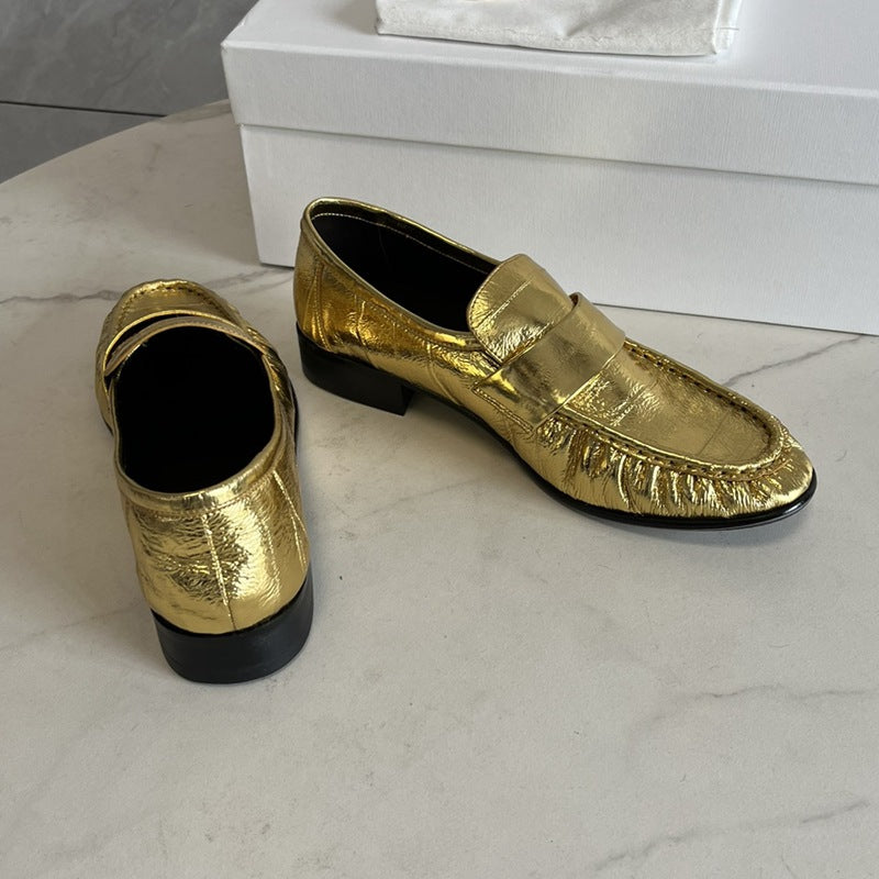 Eel skin loafers for women by Rossie Viren, showcasing sleek, textured footwear with a classic slip-on design.