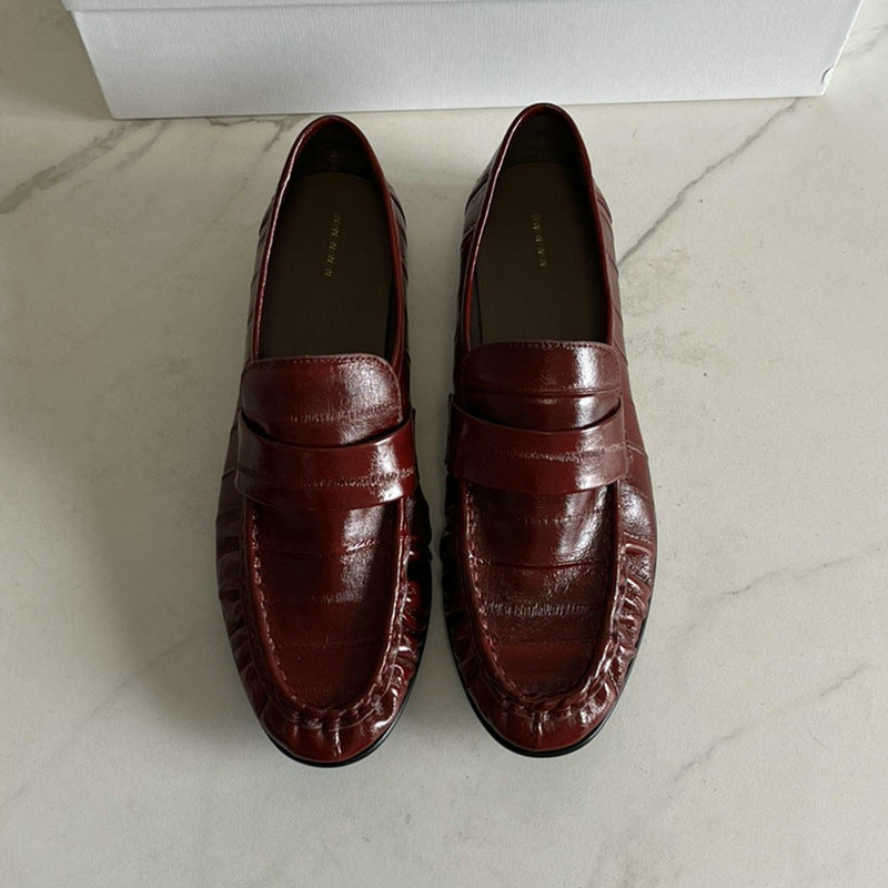 Rossie Viren eel skin loafers for women, stylish shoes with a sleek design and textured eel skin material.