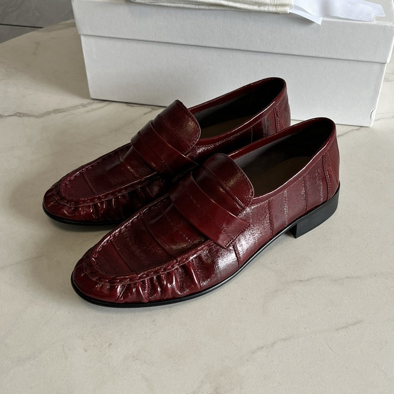 Eel skin loafers for women by Rossie Viren, showcasing sleek, textured eel skin shoes with slip-on design and stylish detailing.