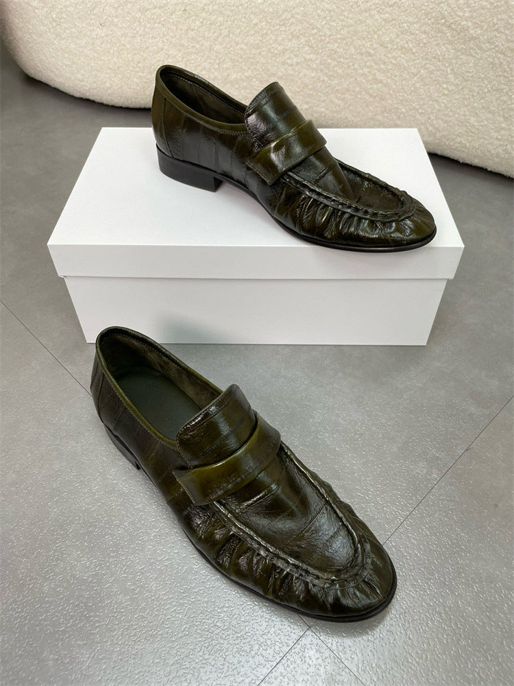 Eel skin loafers for women by Rossie Viren, featuring sleek design and textured eel skin material.