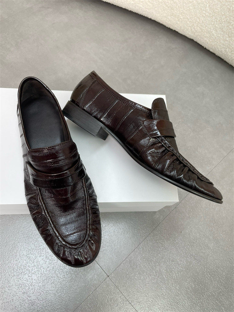 Rossie Viren eel skin loafers for women featuring sleek slip-on shoes with textured eel skin finish and comfortable design.