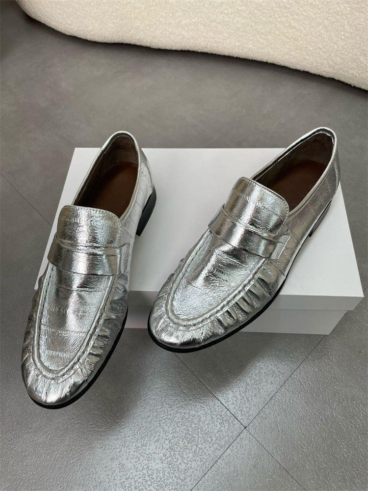Eel skin women's loafers by Rossie Viren featuring sleek, textured eel leather and classic slip-on shoe design.