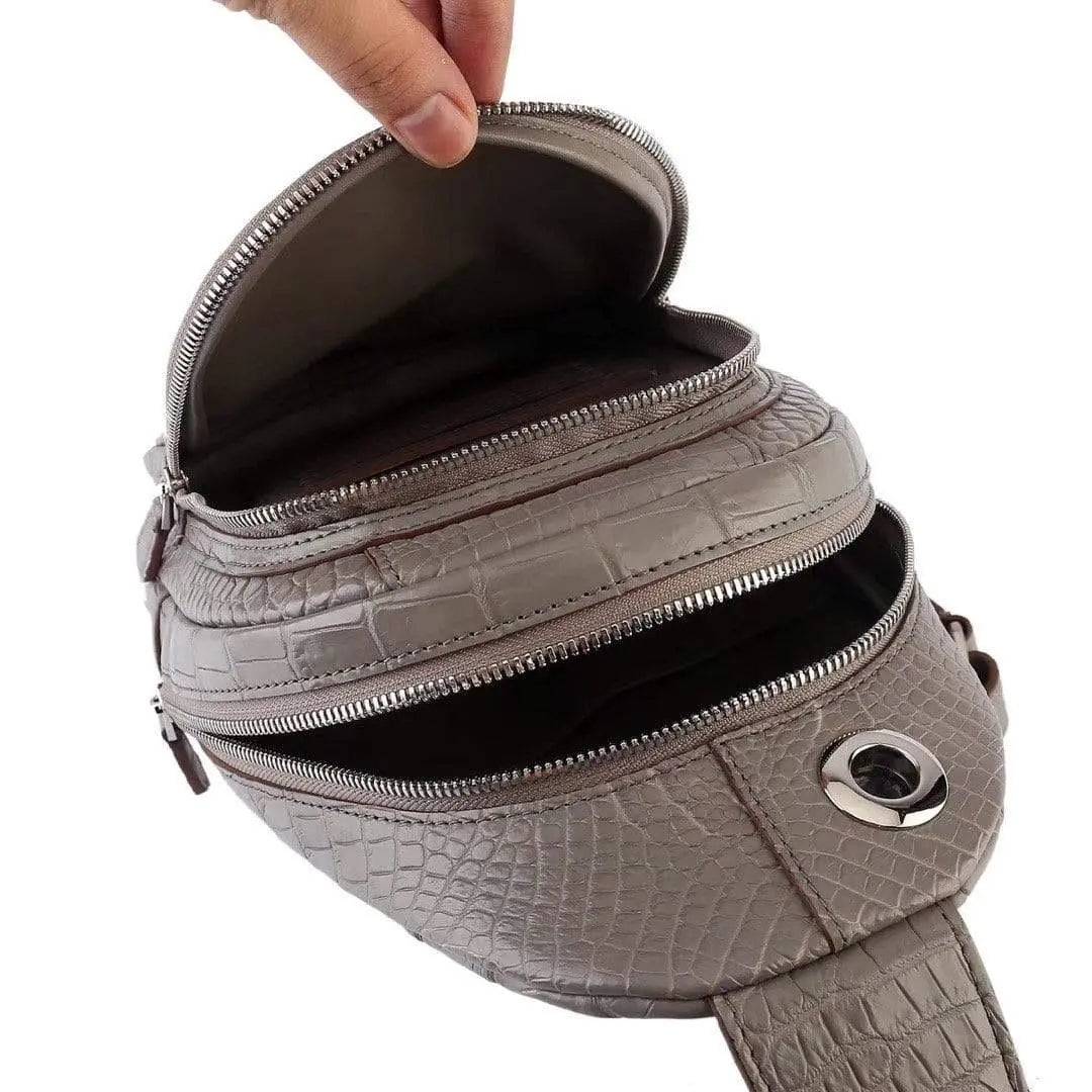 Crocodile leather men's sling chest bag by Rossie Viren, stylish messenger handbag for travel, hiking, and everyday use.
