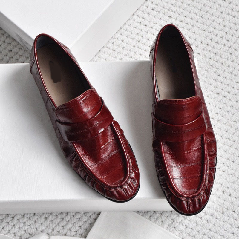 Eel skin loafers for women by Rossie Viren, stylish shoes with smooth eel skin texture and classic slip-on design.