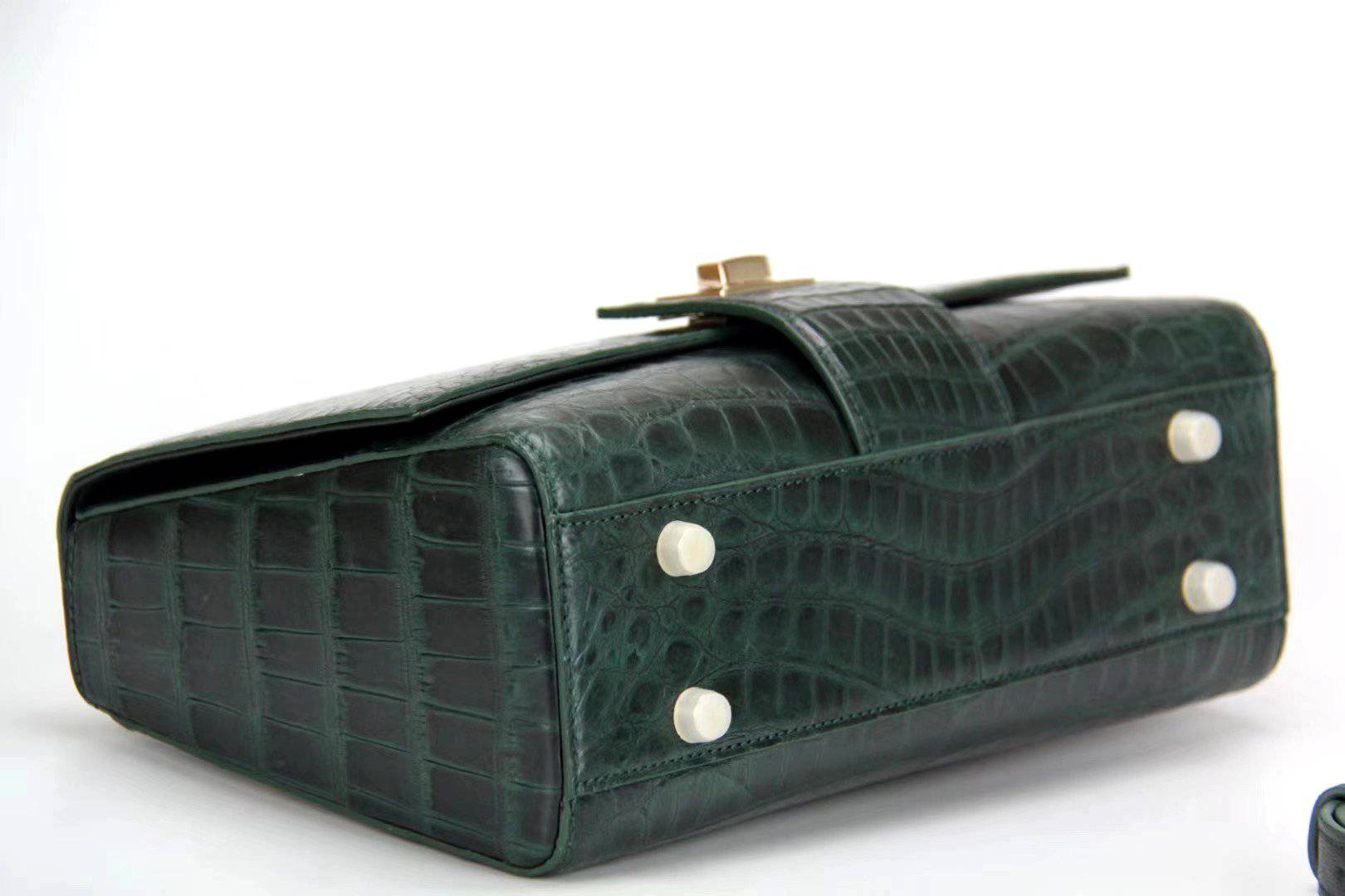 Women's crocodile leather messenger handbag by Rossie Viren with a cross-body strap and top handle, stylish and durable.