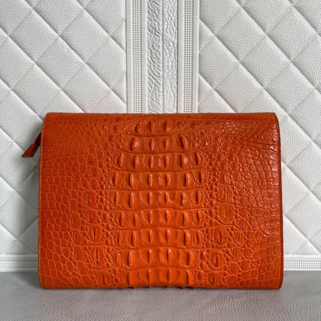 Women's genuine crocodile leather clutch with a card holder design by Rossie Viren, showcasing the textured crocodile pattern.