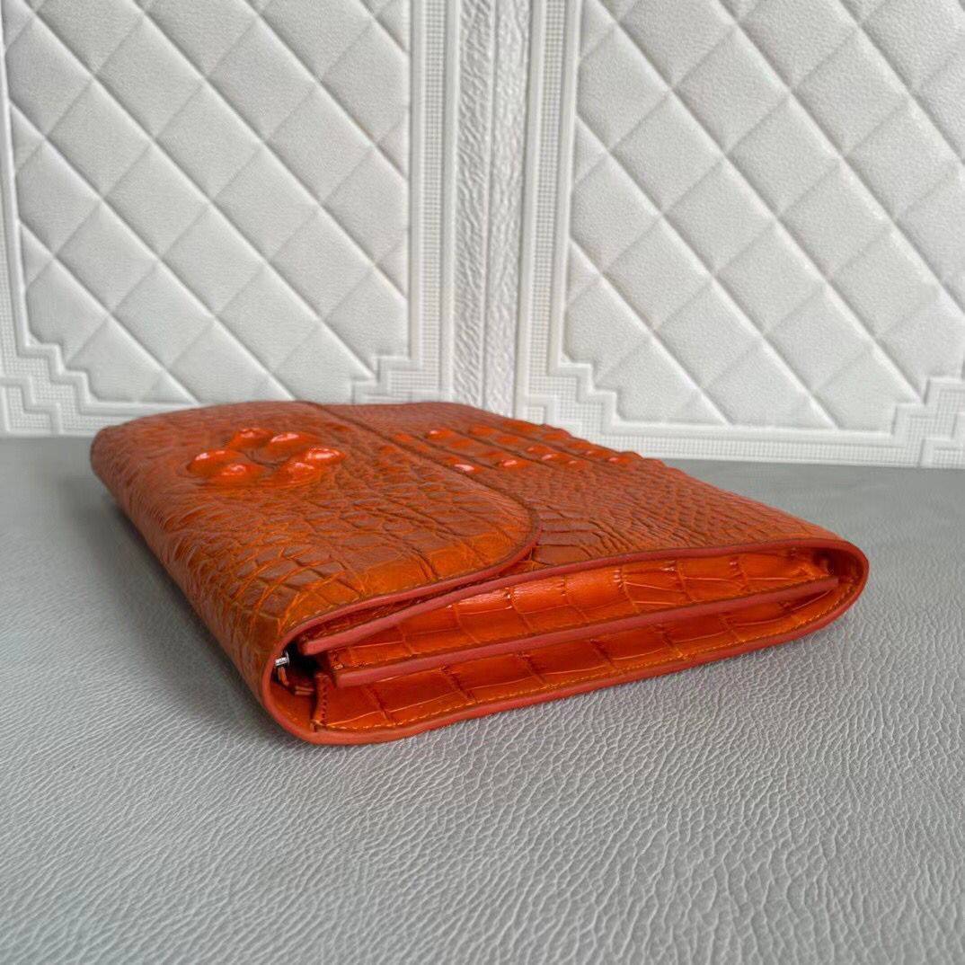 Women's genuine crocodile leather clutch card holder by Rossie Viren, showcasing sleek design and textured crocodile pattern.